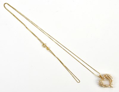 Lot 2066 - A yellow metal heart shaped diamond set...