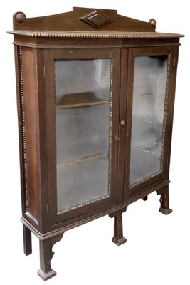 Lot 48 - A 1920s oak bookcase, with pair of glazed...