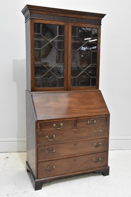 Lot 99 - A Georgian mahogany bureau bookcase, the upper...