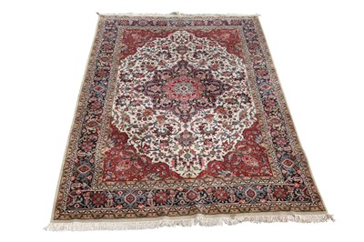 Lot 1252 - A hand knotted red ground Keshan carpet, 280 x...