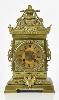 Lot 1281 - A brass cased mantel clock, the gilt face set...