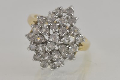 Lot 1319 - A yellow metal white stone cluster ring,...