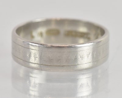 Lot 1263 - A platinum wedding band, size K, approx 4.9g.