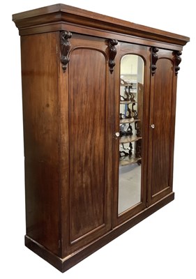 Lot 31 - A Victorian mahogany three door wardrobe, with...