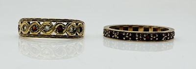Lot 1026 - A 9ct yellow gold half eternity ring (one...