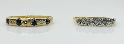 Lot 1027 - An 18ct yellow gold platinum tipped five stone...