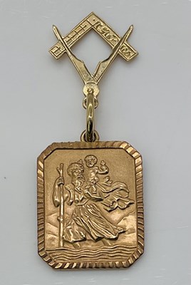 Lot 1030 - Two 9ct gold pendants, a St Christopher plaque...