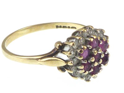 Lot 1046 - A 9ct gold ruby and diamond cluster ring, size...