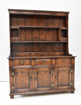 Lot 53 - A reproduction oak dresser, with three drawers...