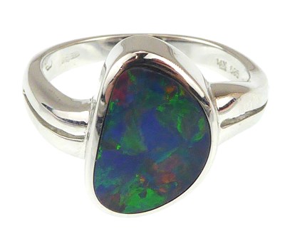 Lot 1035 - A contemporary 14ct white gold ring with bezel...