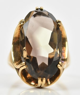 Lot 433 - A 9ct yellow gold dress ring, set with an oval...