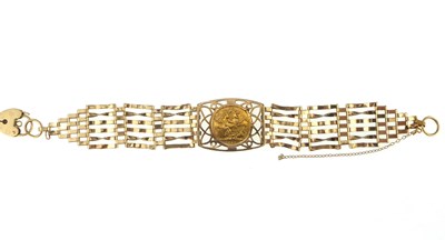 Lot 1115 - A 9ct gold six bar gate bracelet with central...