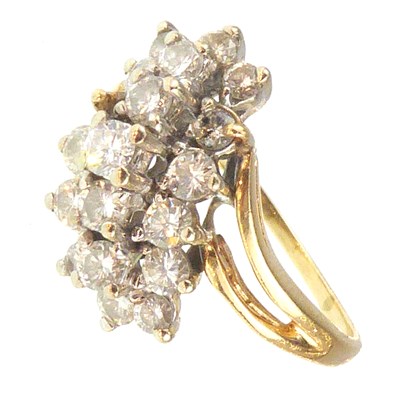 Lot 1034 - A 14ct gold diamond cluster ring with central...