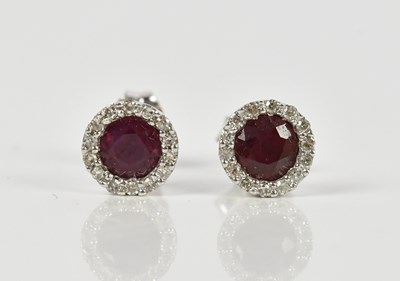 Lot 1382 - A pair of white metal ear studs, stamped 375,...