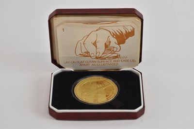 Lot 1693 - POBJOY MINT; a 22ct gold plated silver...