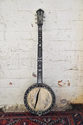 Lot 1326 - An early 20th century banjo, with rosewood and...