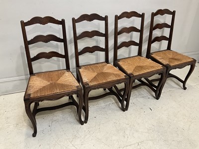 Lot 2080 - A set of four French Provincial rush seated...
