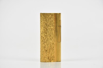 Lot 382 - DUNHILL; a gold plated textured cigarette...