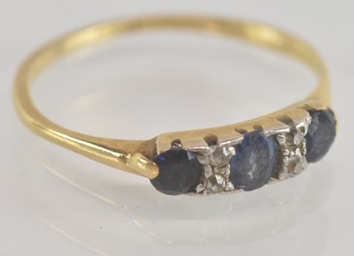 Lot 1258 - An 18ct yellow gold sapphire and diamond set...