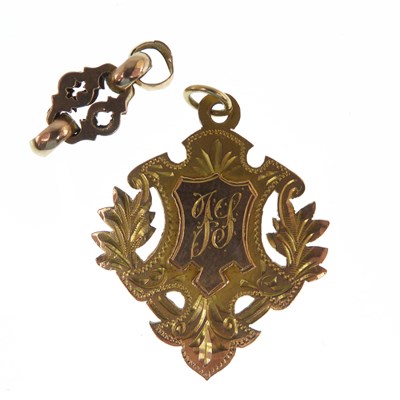 Lot 1205A - A 9ct gold fob pendant of shield form, central...