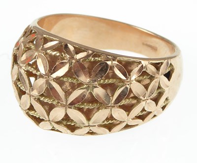 Lot 1067 - A modern 9ct rose gold dress ring with pierced...