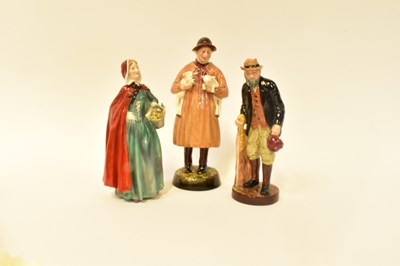 Lot 99 - ROYAL DOULTON; three pottery figures...