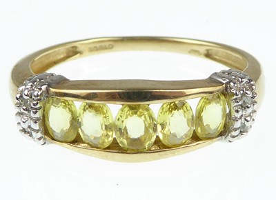 Lot 1066 - A 9ct gold dress ring with five tension set...