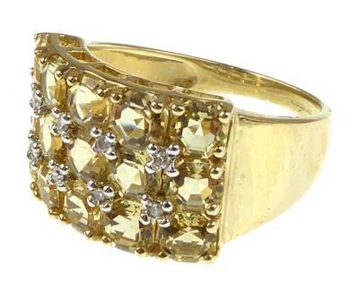 Lot 1069 - A 9ct gold cluster dress ring with three lines...