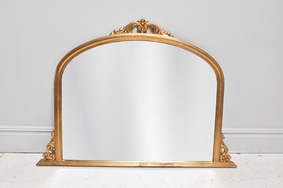 Lot 1012 - A reproduction gilt framed overmantel mirror,...