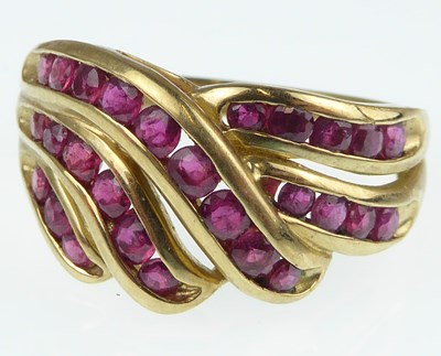 Lot 1068 - A contemporary 9ct gold and ruby ring with...
