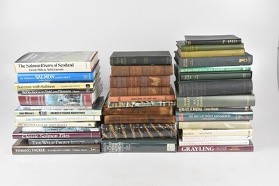 Lot 261 - FISHING; a collection of books on fishing and...