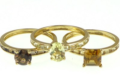 Lot 1099 - Three 9ct gold dress rings, each with...