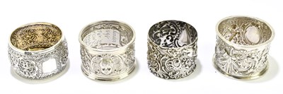 Lot 2397 - Four hallmarked silver napkin rings comprising...