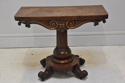 Lot 242 - A 19th century carved mahogany fold-over tea...