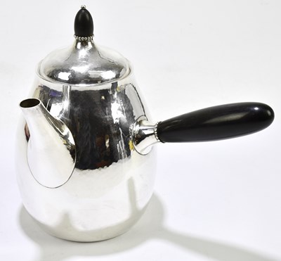 Lot 2040 - GEORG JENSEN; a hammered silver coffee pot,...