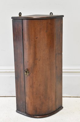 Lot 198 - A 19th century mahogany corner cupboard of...