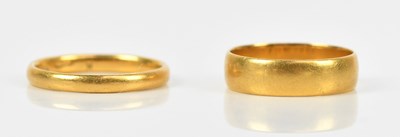 Lot 431 - Two 22ct yellow gold wedding bands, size J 1/2...