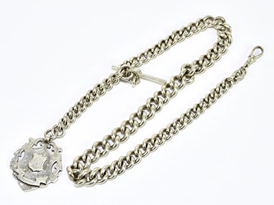 Lot 1843 - A hallmarked silver graduated curb link Albert...
