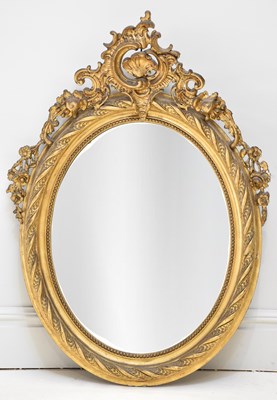 Lot 27 - A 19th century Rococo style gilt framed oval...