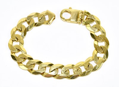 Lot 1245 - A yellow metal curb link bracelet, stamped 375,...