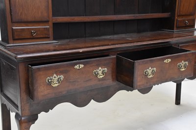 Lot 35 - A late 18th century crossbanded oak dresser,...