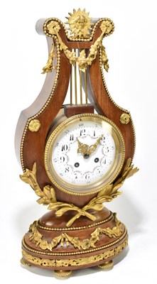 Lot 1477 - A French ormolu mounted kingwood mantel clock