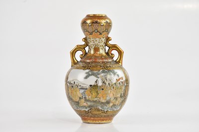 Lot 1672 - A Japanese Kutani twin handled bulbous vase,...