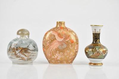 Lot 1709 - A Japanese Kutani bottle vase, decorated with...