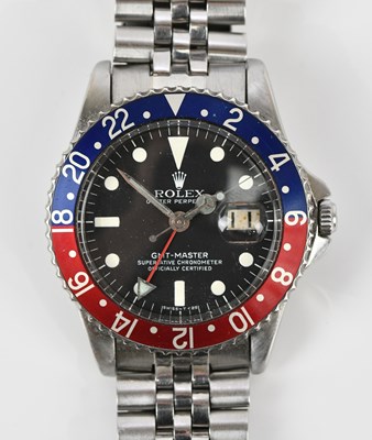 Lot 450 - ROLEX; a gentleman's stainless steel GMT...