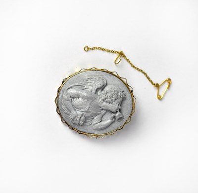 Lot 1147 - A 19th century lava cameo brooch with winged...