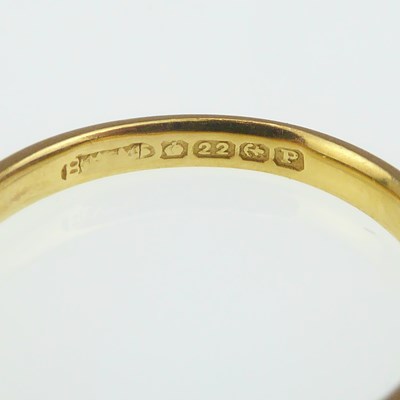 Lot 992 - A 22ct gold thin wedding band, size J, approx....