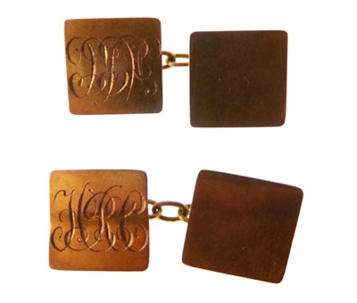 Lot 1199 - A pair of 9ct gold cufflinks united by chain,...