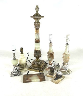 Lot 2728 - A pair of onyx lamp bases, one larger and two...
