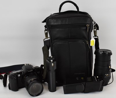 Lot 690 - CANON; an EOS 500 35mm camera with zoom lens,...